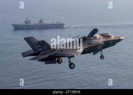 Patuxent River, United States. 11th Oct, 2023. A U.S. Marine Corps F-35B stealth fighter aircraft flown by USMC Test pilot, Maj Paul Gucwa approaches to land on the flight deck of the Royal Navy Queen Elizabeth-class aircraft carrier HMS Prince of Wales during final First of Class sea trials, October 11, 2023 off the coast of Maryland, USA. Credit: Dane Wiedmann/U.S. Navy Photo/Alamy Live News Stock Photo