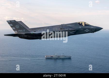 Patuxent River, United States. 11th Oct, 2023. A U.S. Marine Corps F-35B stealth fighter aircraft flown by USMC Test pilot, Maj Paul Gucwa circles to land on the flight deck of the Royal Navy Queen Elizabeth-class aircraft carrier HMS Prince of Wales during final First of Class sea trials, October 11, 2023 off the coast of Maryland, USA. Credit: Dane Wiedmann/U.S. Navy Photo/Alamy Live News Stock Photo