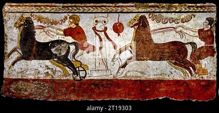 Man racing a chariot past the winning post, 3rd century BC,  Lucanian fresco tomb,  The ruins of Paestum are famous for their three ancient Greek temples in the Doric order  550 to 450 BC Stock Photo