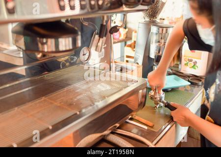 Close-up of a Barista making a coffee in a cafe Stock Photo