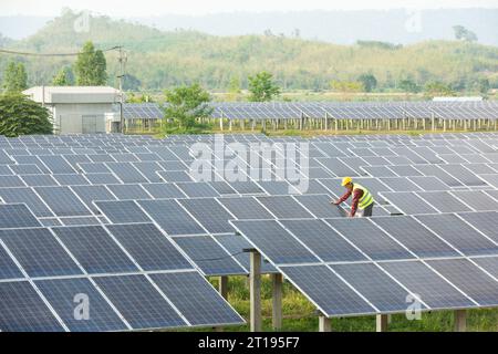 Portrait of an engineer working on solar panels at a solar powered station, Thailand Stock Photo