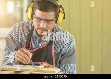 Portrait of a carpenter working in a workshop, Thailand Stock Photo