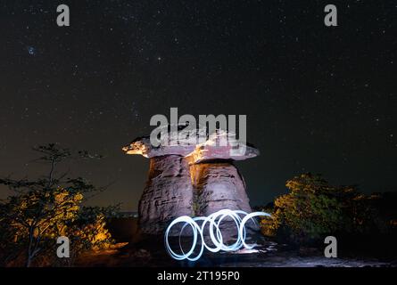 Lights in front of Dramatic rock formations at night, Sam Pan Bok, Ubon Ratchathani, Thailand Stock Photo