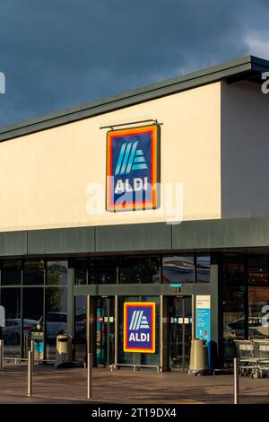 Exterior of Aldi supermarket in Deal Kent England UK with dark sky above. Stock Photo