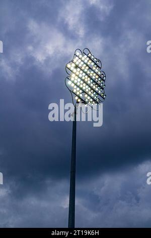 The floodlights (just before it was rained off) at an evening T20 match at Headingley Cricket Ground at Leeds, Yorkshire, England UK Stock Photo
