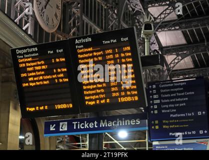 Evening departures and arrivals board and ticket machines, at Lime St, Liverpool, Merseyside, England, UK,,L1 1JD Stock Photo