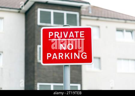 Private No Parking sign in front of a residential building Stock Photo