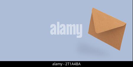 Recycled craft paper envelope isolated blue background levitation mockup banner Stock Photo