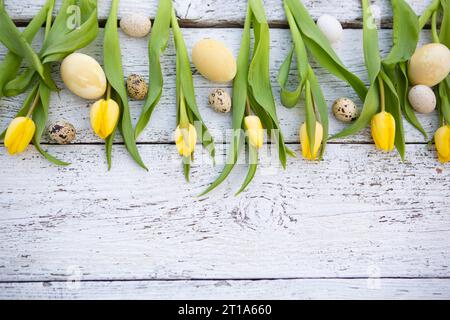 7 February 2023: Wooden background with text free space with colorful tulips and quail eggs. Symbol image Easter *** Hintergrund aus Holz mit Textfreiraum mit bunten Tulpen und Wachteleiern. Symbolbild Ostern Credit: Imago/Alamy Live News Stock Photo