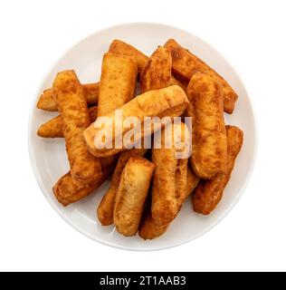 Cheese sticks. Bread sticks on a plate on a white background. homemade baking Stock Photo