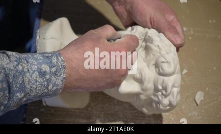 The process of processing and polishing plaster figures. A factory for ...