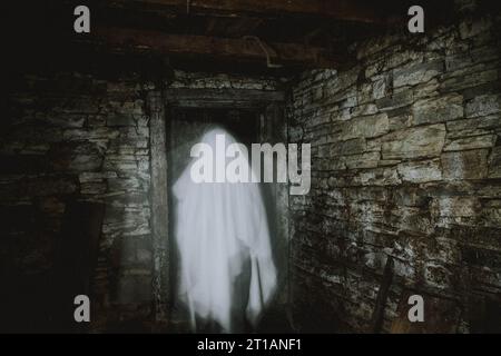 ghost in abandoned building Halloween background Stock Photo