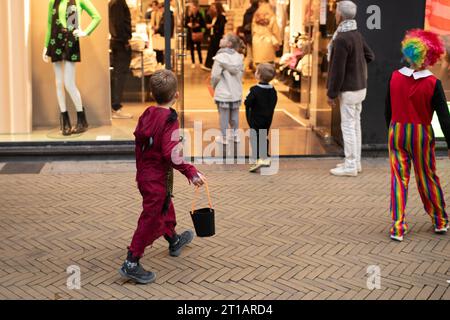 Children dressed up in the city on Halloween asking for candy Stock Photo