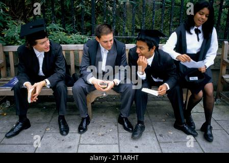 Freshers Week, Oxford University students after matriculation and wearing subfusc, which is a requirement for formal enrolment, students chatting together outside Kings Arms pub. Oxford, Oxfordshire, England circa September 1990s. 1995 UK HOMER SYKES Stock Photo