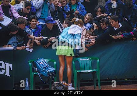 Monica Seles (YUG) signing autographs for fans at the 1989 French Open Tennis. Stock Photo
