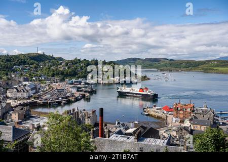 View over the harbour town of Oban to the ferry harbour with the ferry Isle of Lewis operating between Oban and Isle of Barra, Argyll and Bute Stock Photo