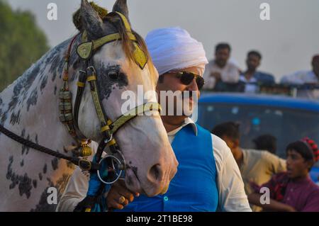 Islamabad, Pakistan. 12th Oct, 2023. Pakistani horsemen charge on a ...