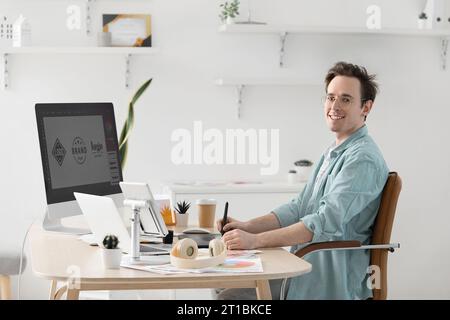 Male graphic designer developing logotype in office Stock Photo