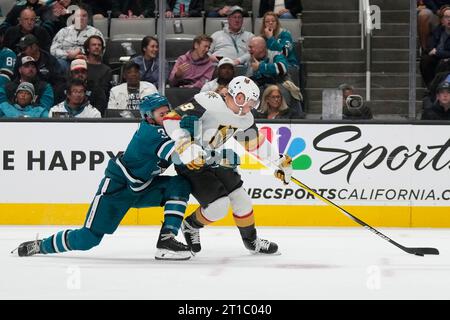 Vegas Golden Knights center Ivan Barbashev (49) moves the puck against  Dallas Stars defenseman Ryan Suter (20) and center Max Domi (18) during the  first period of an NHL hockey game in