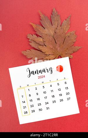 January 2024 calendar page with push pin on red background Stock Photo ...