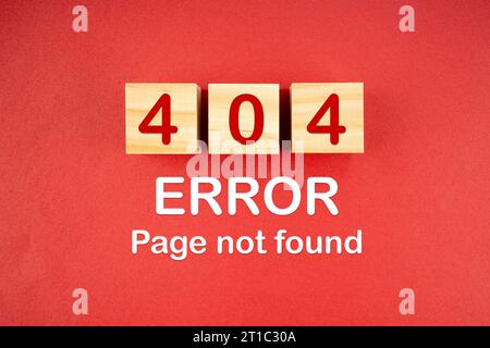 Wooden cubes with 404 error page not found on red background. Stock Photo