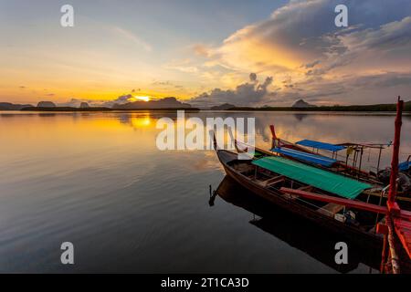 Ban Sam Chong Tai and colorful sunrises that emerges behind the giant limestone mountains, Phang-nga, Thailand Stock Photo