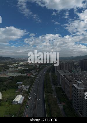 Aerial view of Sanxia District with cars on highway in New Taipei City, Taiwan. National Taipei University (NTPU) located here. Stock Photo