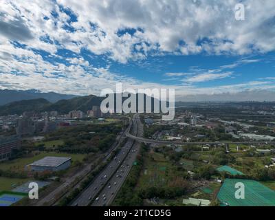 Aerial view of Sanxia District with cars on highway in New Taipei City, Taiwan. National Taipei University (NTPU) located here. Stock Photo