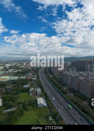 Aerial view of Sanxia District with cars on highway in New Taipei City, Taiwan. National Taipei University (NTPU) located here. Stock Photo