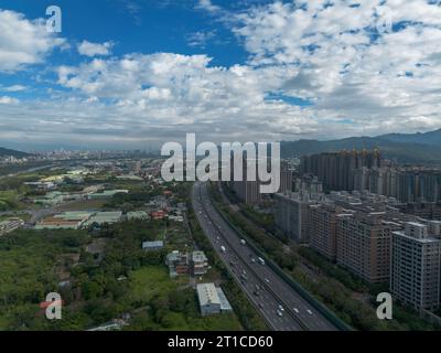 Aerial view of Sanxia District with cars on highway in New Taipei City, Taiwan. National Taipei University (NTPU) located here. Stock Photo