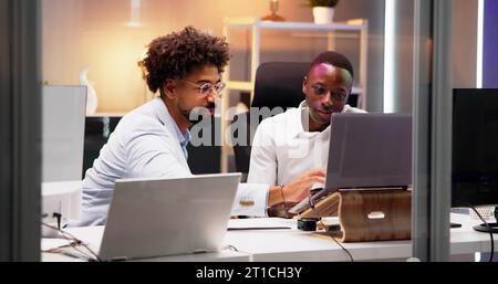 Business People Training On Computer. Young Workers In Office Stock Photo