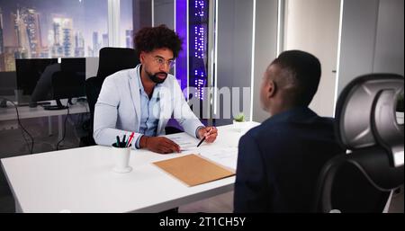 Smiling Young Businessman Shaking Hands With His Partner Stock Photo
