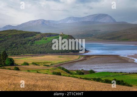 The ruined Castle Varrich with Ben Hope in the background, near the village of Tongue, Sutherland, Scotland. Stock Photo