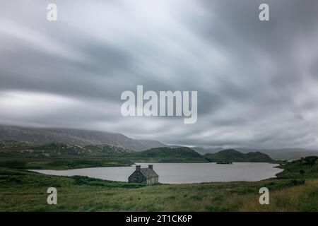 Loch Stack is an idyllic lake in the Northwest of Scotland. The bothy at the shore of the loch is a famous photo spot. Stock Photo