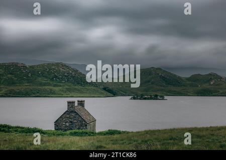 Loch Stack is an idyllic lake in the Northwest of Scotland. The bothy at the shore of the loch is a famous photo spot. Stock Photo