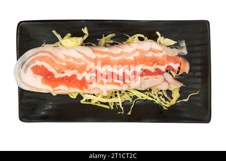 Die cut of Sliced pork on shredded cabbage on white isolated. Stock Photo