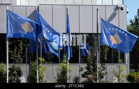 Kosovo national flags at the building of the Government of The Republic of Kosovo Stock Photo