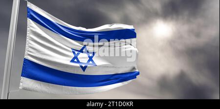 The national flag of the State of Israel .Hamas Attack: Israel Weighs Ground Invasion on Gaza Strip in Risky Strategy Stock Photo