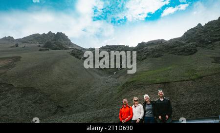 People with big cliff and blue skies on adventure in winter Stock Photo