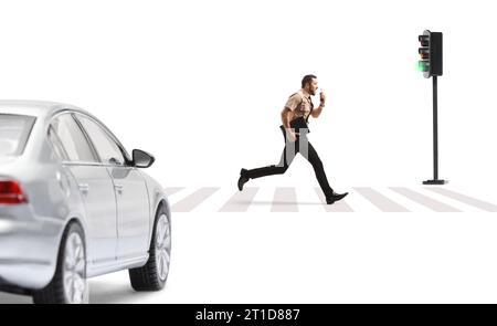 Full length profile shot of a security officer running in front of a car and using a walkie talkie isolated on white background Stock Photo