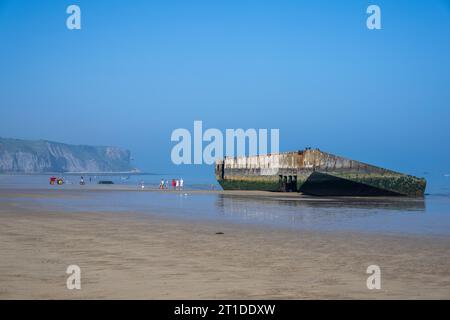 Remains of a Mulberry Harbour on the beach at Arromanches-les-Bains, Normandy, France. Stock Photo
