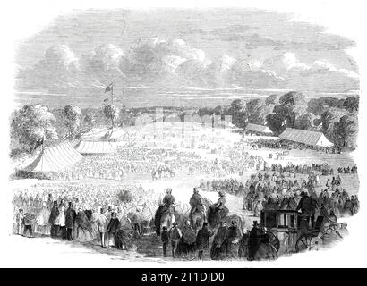 Ragged School Festival at Muswell-Hill, 1860. 'This festival, originated with the view of affording a holiday to the numerous children belonging to the various ragged schools of the metropolis [ie London]...was celebrated...on the Tottenham-wood Estate...By twelve o'clock 7420 children had assembled on the grounds, where they quickly engaged in the sports provided for them. They were accompanied by the bands of the Coldstream Guards, the Victoria Rifles, and the fife and drum bands of the East London and Whitechapel Shoeblack Brigades. Mr. John Masterman, banker, the Messrs. Rhodes, late propr Stock Photo