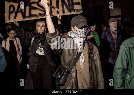 Dublin, Ireland. 9th Oct, 2023. An activist holds a placard during the demonstration. Two days of demonstrations have taken place in Dublin by members of the Palestinian community as well as supporters from various diaspora and by locals and activist groups in a show of solidarity in light of recent strikes on Gaza by Israeli military forces. Protestors gathered in Dublin City centre, at government buildings and marched to the Israeli Embassy where speeches were made by members of the Palestinian community, students, activists and members of Irish political socialist party People Before Prof Stock Photo