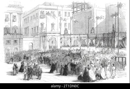 Proclaiming the result of the vote on the annexation question before the Royal Palace, Naples, 1860. 'Three sides of the square were occupied by the National Guard, and the fourth by a booth, on the top of which floated three or four national flags. Up and down the hollow square were scattered a few hundreds of persons, waiting for the long-deferred proclamation, and many appeared thoroughly tired out, when at last a flourish of trumpets announced that the Judges of the Supreme Court were coming...The President made a speech, which was received with occasional vivas. At last the number of the Stock Photo