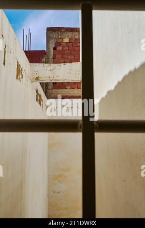 brick wall with a metallic window Stock Photo
