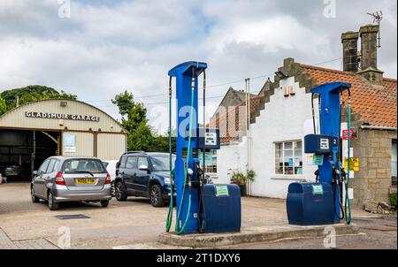 Old fashioned garage and petrol pumps, Gladsmuir, East Lothian, Scotland, UK Stock Photo