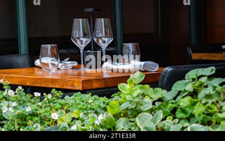 table set for dinner in open restaurant on city street in Montreal, Canada Stock Photo