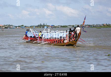 Kampong Chhnang, Cambodia. October 13, 2023 : Racing boat training in preparation for the Bon Om Touk Water Festival races (November 26-28) and Pursat River regatta (November 4-6). Boat crews were urged by officials to train hard as this traditional Khmer celebration return to Phnom Penh after being canceled for three consecutive years. The event honors the occasion of the Tonle Sap River reversing its flow, a unique event that attracts millions people, locals and tourists. Today, Cambodian people start a 3 days public holiday for Pchum Ben Ancestor's Day. Credit: Kevin Izorce/Alamy Live News Stock Photo