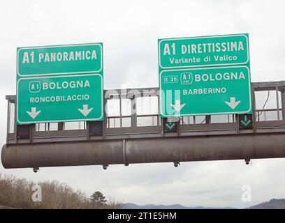 road sign indicating the crossroads in central Italy with two alternatives with the panoramic road or the direct road on the motorway Stock Photo