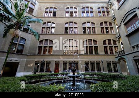 Medellin, Colombia - January 10, 2023: Internal courtyard of the Rafael Uribe Palace of Culture with visitor walking through it Stock Photo